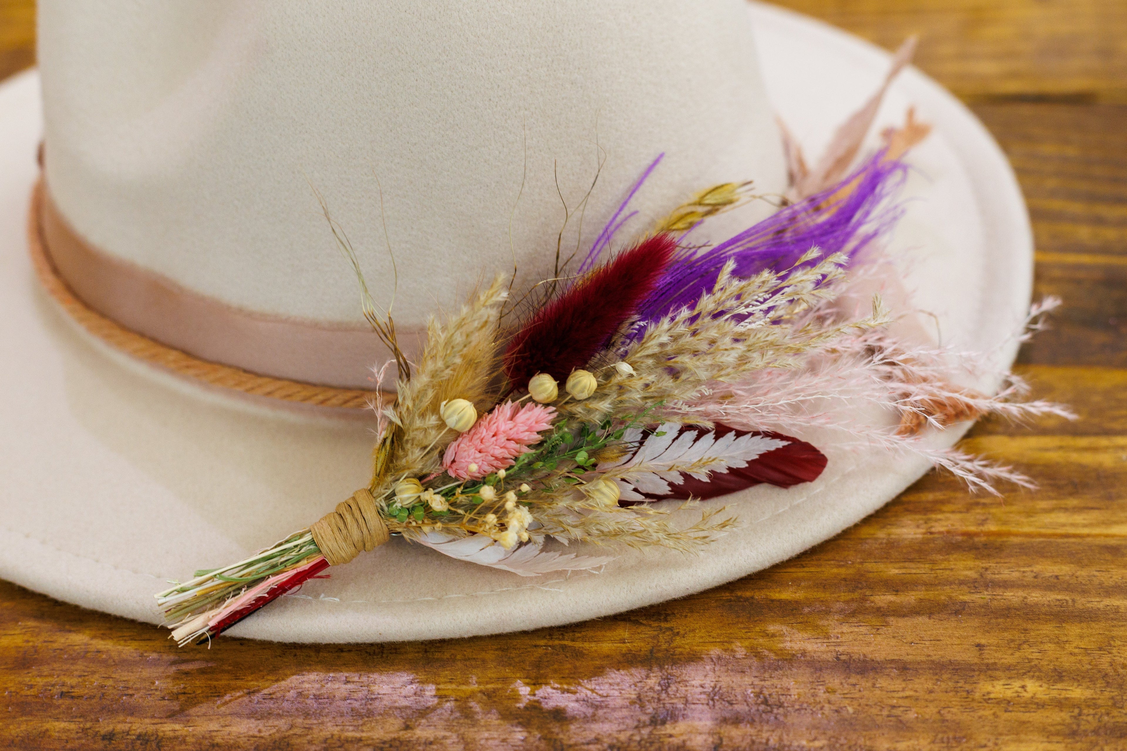 brimbuds classic hat pin on a cream color wide brim hat