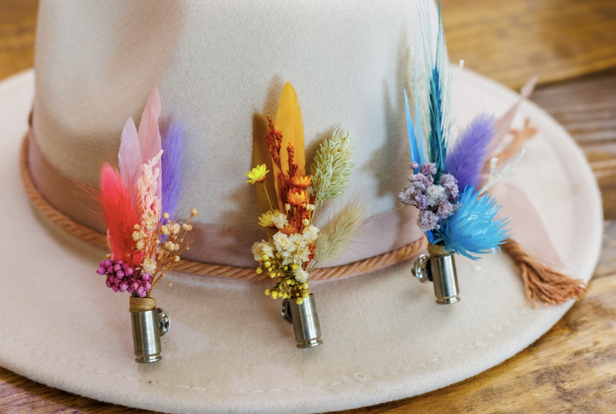 Colorful feather and flower decorations on a hat