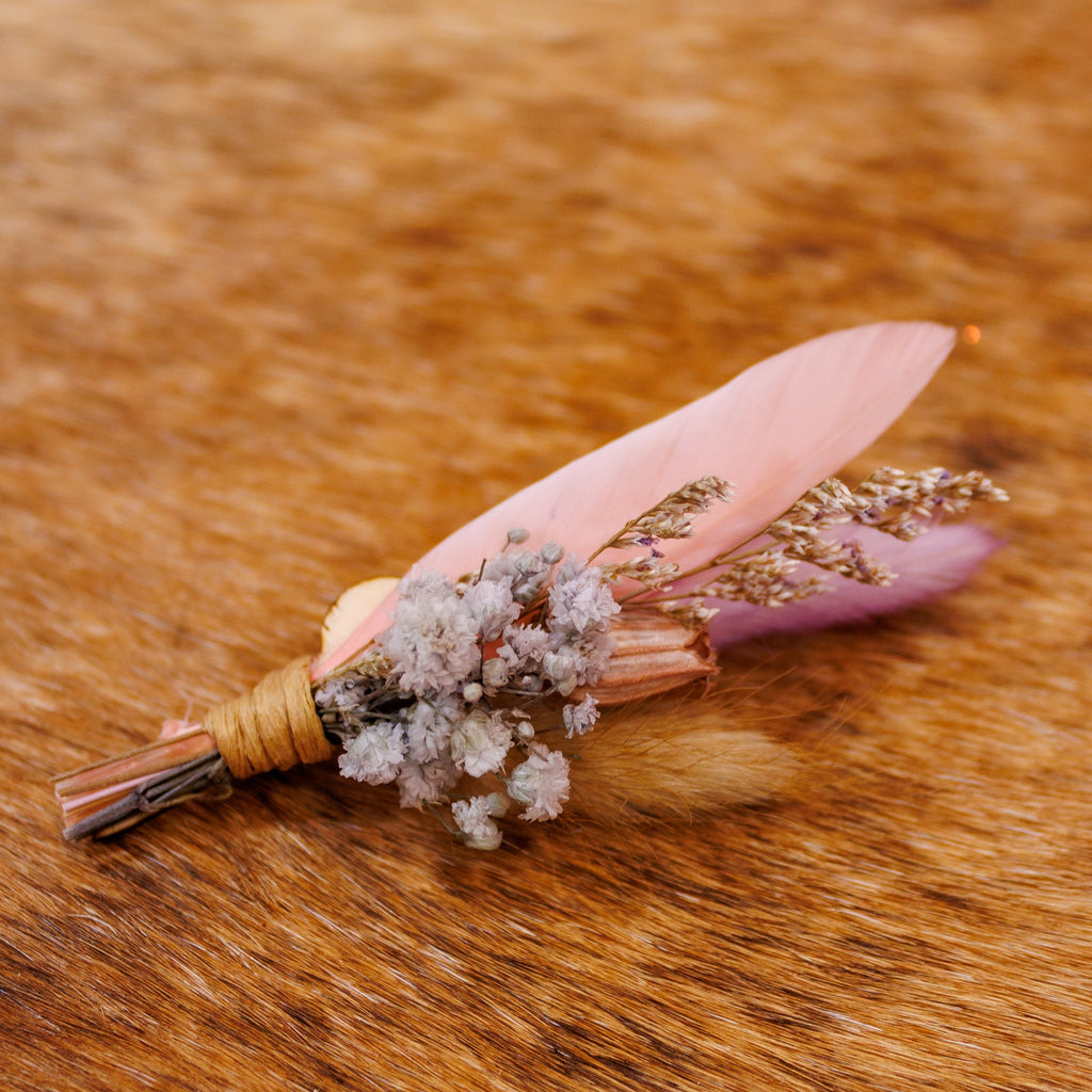 BittyBud hat pin with a peach pink feather, lavender feather, tan bunny tail, and pale lavender baby's breath